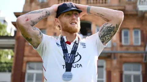 England captain Ben Stokes puts his hands on his head as he stands in front of the Lord's pavilion after victory over India 