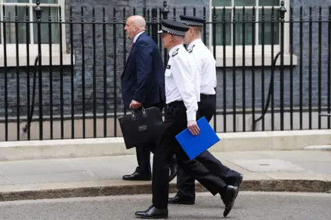 PA Media Metropolitan Police Commissioner Sir Mark Rowley arrives at Downing Street.