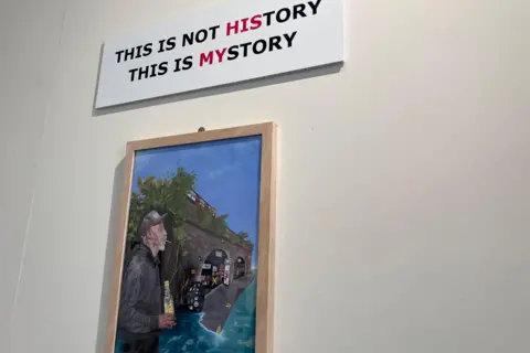 Henry Godfrey-Evans/BBC An art piece with the words "This is not history, this is my story". The words "his" and "my" are highlighted in red.