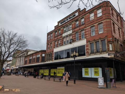 House of Fraser building with closing down signs in the windows