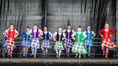 Dumfries and Galloway Council A troop of young Scottish dancers in colourful traditional dress