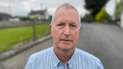 A close up image of Declan Weir with a blurred background