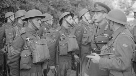 Members of the Suffolk Regiment with King George VI in 1941