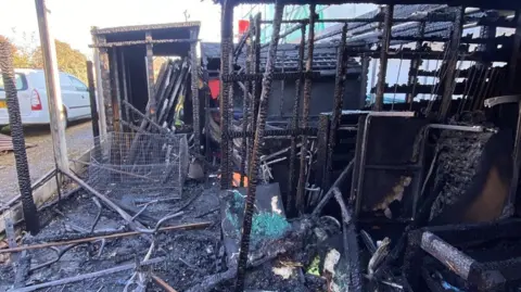 Tendring District Council The interior of a building, burnt to black, some structures are still standing and others are sprawled across the floor