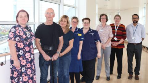 From left, Lara Teare, Seamus Connolly, Maria Connolly and other UHCW staff