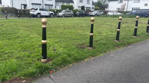 Bollards on a green