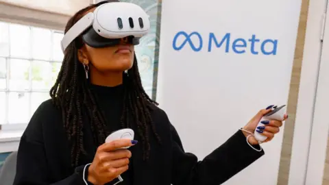 Getty Images A woman using the Quest 3 headset. It is white, clean and goggle-shaped. However, it looks less sleek and futuristic than Apple's product. In comparison, you would struggle to argue it looks as cool as the Vision Pro.