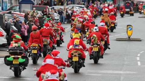 Boundary 500 Motorcycle Group founder Brian Lavery Back view of a motorcyclists dressed as Santa Clause