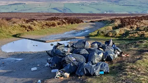 About 20 black bin bags full of household wase dumped on Ilkley Moor 