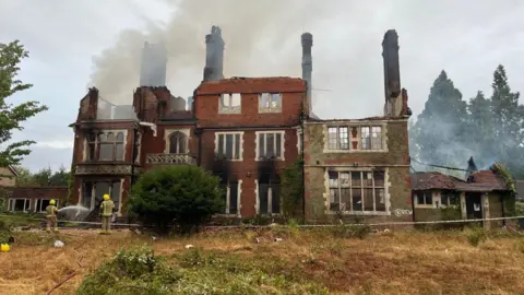 HIWFRS Charred remains of large former care home in Liss . It is a sprawling grand building over three floors.