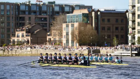 PA Media Oxford and Cambridge rowing teams on the Thames