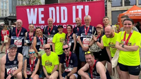 Sunderland Strollers A group of people with their medals 