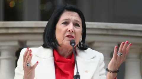 Outgoing Georgian President Salome Zourabichvili delivers a statement outside the Orbeliani Palace in Tbilisi, Georgia, 29 December 2024