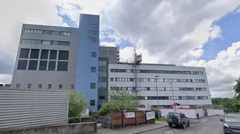 The Oxford Eye hospital, which is on the John Radcliffe site in Oxford. It is a grey and blue building.