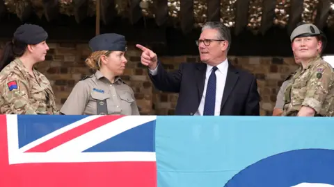 Sir Keir Starmer meets uniformed aircrew members during a visit to Taif Airbase in Saudi Arabia, 8 April.