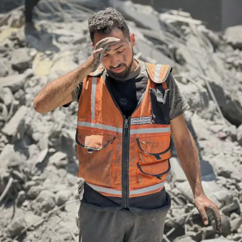 BBC Rescue worker Abdullah al-Majdalawi in Gaza City. "I have become afraid of my own memories," he said.