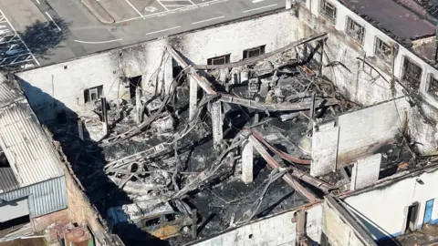 Scottish Drone Adventures The burnt out shell of a building with burnt vehicles inside