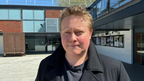 Zac Sherratt/BBC Ben Annett, 20, acting student looks slightly away from the camera.