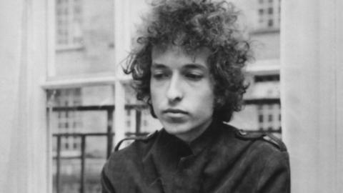 A black and white photo of Bob Dylan