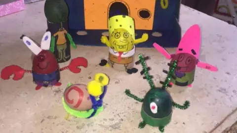 Janeane Kearney/PA Wire Five eggs depicting various characters from SpongeBob SquarePants, including SpongeBob in the centre in yellow.