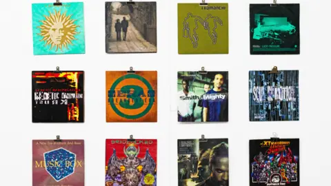 Martin Boileau Three rows of four album covers are pictured