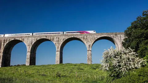 Translink A enterprise service passes over the viaduct outside Newry 