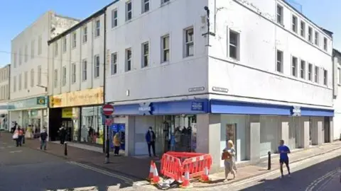 A Google Streetview screenshot of the former Halifax bank on the corner of King Street and Roper Street in Whitehaven.