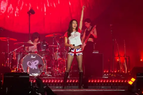 Getty Images Olivia Rodrigo wears a pair of sequinned Union Jack hot pants as she performs during day five of Glastonbury Festival on 29 June 2025.