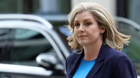 Reuters Britain's Leader of the House of Commons Penny Mordaunt arrives for a BBC election debate, in London, Britain, June 7, 2024
