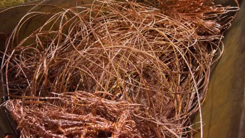 Getty A large number of copper cables tangled up in a receptacle