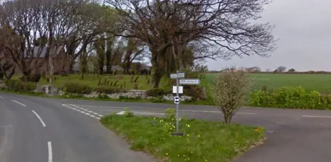 The Ballaugh Loop Road , you can see Jurby Church in the background.