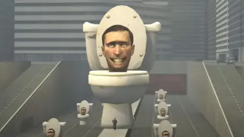 YouTube/DaFuq!?Boom! An image shows a large smiling man's head coming out of a toilet bowl. There are smaller versions of the same picture surrounding the larger one.