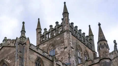 PA Media The parapet marking King Robert the Bruce at the Abbey Church of Dunfermline in Fife.