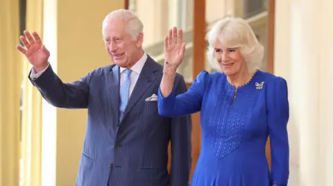 Getty Images King Charles and Queen Camilla waving