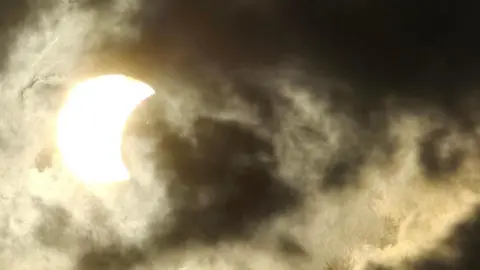 Becko Is Fab | BBC Weather Watchers Cloudy sky obscures the partial eclipse, or possibly makes it safer to view