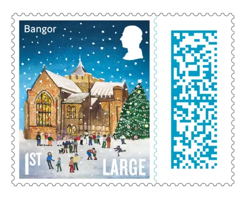 Royal Mail The stamp for Bangor. It is an illustration of St Deiniol's Cathedral - it has Bangor written at the top left hand corner, a silhouette of the King's head in the top right, Large is written in the bottom right and 1st in the bottom left. The scene is one of a brown Cathedral with stained glass windows. There are people playing the snow outside with a large Christmas tree to the right. 