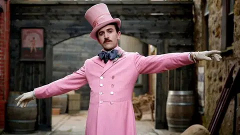 Mad as Birds Actor Callum Scott Howells dressed in a pink frock coat and top hat, portraying Henry Paget, 5th Marquess of Anglesey in the film Madfabulous