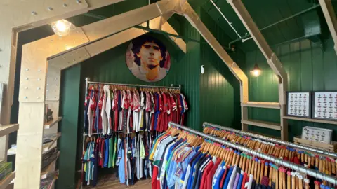 Cowshed Inside a shop with hundreds of vintage football shirts