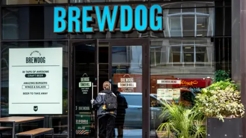 Getty Images A person entering a Brewdog bar in Tower Hill, London.