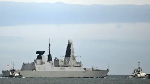 Getty Images HMS Dragon sets sail from Portsmouth Harbour on March 10, 2026 in Portsmouth, England