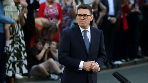 Reuters Prime Minister Andy Burnham outside Number 10 Downing Street on his first day in the job.