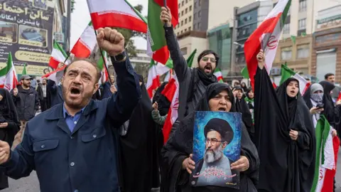 Getty Images Iranians protest against attacks on Iran by Israel and the United States on 28 February 2026 in Tehran, Iran.