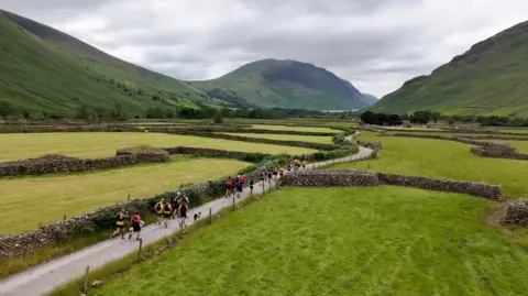 An aerial image of runners making their way through the valley to Wasdale Head