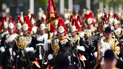 PA Media Members of the Household Cavalry Mounted Regiment on the Mall after Trooping the Colour