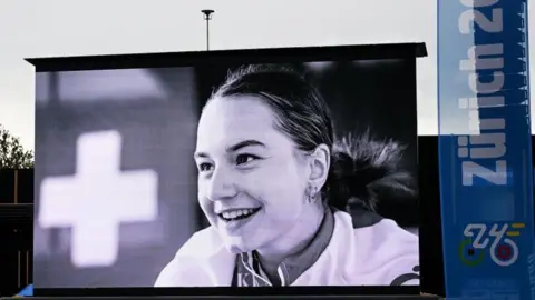 A picture of Muriel Furrer is displayed at the Road World Championshis in 2024