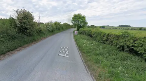 Google The A364 going between hedges and fields on either side. The road is empty.