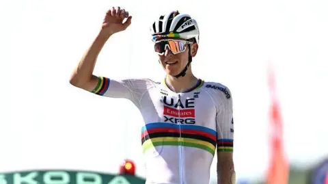 Tadej Pogacar celebrates winning stage 12 of the 2025 Tour de France