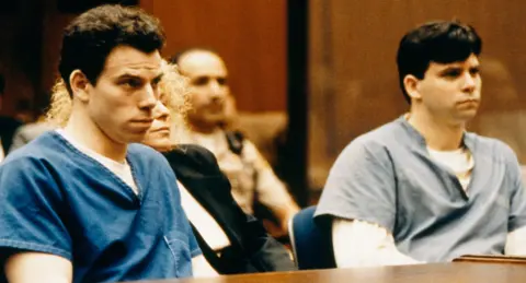 Getty Images Erik and Lyle Menendez - wearing prison garbs - observe proceedings with pensive faces during their trial in 1994