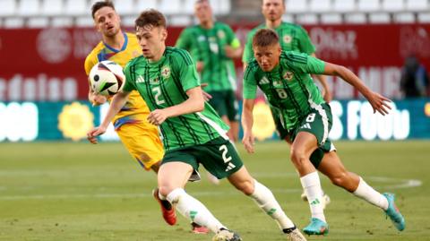 Conor Bradley on the ball against Andorra