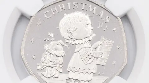 Britannia Coin Company The tails side which showed a Christmas-themed design